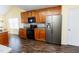 Bright kitchen with stainless steel refrigerator and black range oven at 1003 Southshore Pkwy, Durham, NC 27703