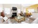 Bright living room with a fireplace and a seamless flow into the dining area, creating an inviting atmosphere at 1003 Southshore Pkwy, Durham, NC 27703