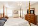 Bright main bedroom featuring a large bed, stylish furnishings, and ample natural light for a serene ambiance at 1003 Southshore Pkwy, Durham, NC 27703