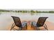 Lounge chairs on a wooden pier over the water providing a relaxing spot to enjoy the scenery at 1003 Southshore Pkwy, Durham, NC 27703