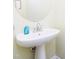 A pedestal sink is featured in this minimalist powder room design at 1003 Southshore Pkwy, Durham, NC 27703