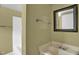 Bathroom with white shower, mirror, and sink at 1007 Grace Ave, Burlington, NC 27217