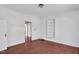 White bedroom featuring hardwood floors at 1007 Grace Ave, Burlington, NC 27217