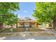 Quaint single-Gathering home featuring a well-manicured lawn and beautiful mature trees shading the front yard at 1007 Grace Ave, Burlington, NC 27217