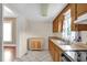 Bright kitchen featuring wooden cabinets and tiled flooring at 1007 Grace Ave, Burlington, NC 27217
