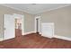 Spacious living room featuring original detailing, wood-look floors, and a decorative fireplace at 1007 Grace Ave, Burlington, NC 27217