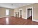 Inviting living room with wood-look floors, neutral walls, a decorative fireplace, and ample natural light at 1007 Grace Ave, Burlington, NC 27217