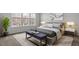 Serene bedroom with large windows, soft carpeting, and a comfortable seating area at 1018 Westerland Way # 204, Durham, NC 27703
