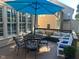 Spacious wooden back deck with comfortable seating and a large blue umbrella at 1021 Golden Star Way, Wake Forest, NC 27587