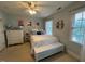 Inviting bedroom with a bed and dresser in a room with soft blue accents and natural light at 1021 Golden Star Way, Wake Forest, NC 27587