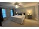 Spacious bedroom with carpet, king bed, two windows, and neutral paint at 1021 Golden Star Way, Wake Forest, NC 27587