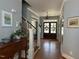 Inviting foyer with hardwood floors, staircase, chandelier and beautiful trim at 1021 Golden Star Way, Wake Forest, NC 27587