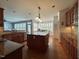 Spacious kitchen with a center island, hardwood floors and plenty of storage at 1021 Golden Star Way, Wake Forest, NC 27587
