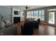 Spacious living room with hardwood floors, fireplace, comfortable seating, and lots of natural light at 1021 Golden Star Way, Wake Forest, NC 27587