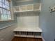Functional mudroom with built-in storage, including shelving, hooks, and bench at 1021 Golden Star Way, Wake Forest, NC 27587
