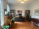 Home office featuring hardwood floors, built-in bookshelves, and a cozy atmosphere at 1021 Golden Star Way, Wake Forest, NC 27587