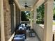 Relaxing covered front porch with comfortable seating, perfect for enjoying the outdoors at 1021 Golden Star Way, Wake Forest, NC 27587