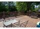 Relax on this back porch with plenty of room for chairs and tables with wooded backyard views at 106 Chariot Dr, Sanford, NC 27330