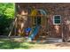 Backyard with a wooden play set that has swings and a slide at 106 Chariot Dr, Sanford, NC 27330