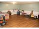Open basement with vinyl flooring, a guitar, and a wagon at 106 Chariot Dr, Sanford, NC 27330