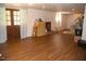 Basement area with wood floors, double doors to the backyard, and a white fireplace at 106 Chariot Dr, Sanford, NC 27330