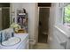 Bright bathroom with a window, vanity and shower stall at 106 Chariot Dr, Sanford, NC 27330