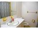 Modest bathroom with a single sink, toilet, and shower with patterned curtain at 106 Chariot Dr, Sanford, NC 27330