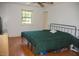 Comfortable bedroom with natural light, hardwood floors, and a relaxing atmosphere at 106 Chariot Dr, Sanford, NC 27330