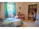 Bright bedroom with natural light, curtains, and a closet at 106 Chariot Dr, Sanford, NC 27330