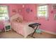 Pink themed bedroom featuring a keyboard and natural light at 106 Chariot Dr, Sanford, NC 27330