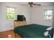 Bright bedroom with hardwood floors, natural light, and a comfortable queen bed at 106 Chariot Dr, Sanford, NC 27330