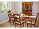 Formal dining room with hardwood furniture and elegant china cabinet at 106 Chariot Dr, Sanford, NC 27330