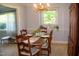 Cozy dining room with a wooden table and traditional decor at 106 Chariot Dr, Sanford, NC 27330