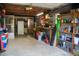 Spacious garage interior featuring shelving and various household items at 106 Chariot Dr, Sanford, NC 27330