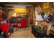 Cluttered garage space with tools, storage, and various equipment at 106 Chariot Dr, Sanford, NC 27330