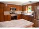 Bright kitchen with stainless steel appliances, ample cabinet space and center island at 106 Chariot Dr, Sanford, NC 27330