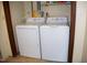 Bright laundry area features a full-size washer and dryer for added convenience at 106 Chariot Dr, Sanford, NC 27330