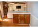 Inviting living room featuring a brick fireplace, wood beams, and comfortable seating at 106 Chariot Dr, Sanford, NC 27330