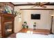Cozy living room with brick fireplace, ceiling fan and large-screen television at 106 Chariot Dr, Sanford, NC 27330