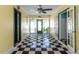 Bright entryway featuring black and white checkered flooring and doors leading to adjacent rooms at 110 W Parker St, Smithfield, NC 27577