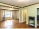 Inviting living room with hardwood floors, neutral walls, and natural light shining through large windows at 110 W Parker St, Smithfield, NC 27577