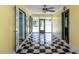 Sunroom with black and white tiled flooring, and bright lighting at 110 W Parker St, Smithfield, NC 27577
