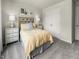 This is a cozy bedroom that includes a queen bed, two nightstands, and a closet at 1116 Landen Creek Ln, Zebulon, NC 27597