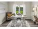 Home office with a modern desk, comfortable seating, a stylish rug, and ample natural light at 1116 Landen Creek Ln, Zebulon, NC 27597