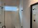 Glass shower with white herringbone tile, bench and window for natural light at 118 Sanderway Dr, Chapel Hill, NC 27516