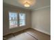 Bedroom features two large windows offering natural light and views of the neighborhood at 118 Sanderway Dr, Chapel Hill, NC 27516