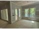 Large room with sliders that lead to a wooden screened porch and wooded backyard views at 118 Sanderway Dr, Chapel Hill, NC 27516