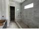 Unfinished bathroom showcases a large shower with tiled walls and a convenient bench at 118 Sanderway Dr, Chapel Hill, NC 27516