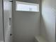 Newly tiled shower with herringbone pattern and built-in bench at 118 Sanderway Dr, Chapel Hill, NC 27516