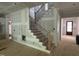 New home staircase featuring wood treads and black iron balusters at 118 Sanderway Dr, Chapel Hill, NC 27516